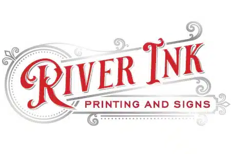 Logo for "River Ink Printing and Signs" in ornate red and gray lettering with decorative scrollwork accents around the text.