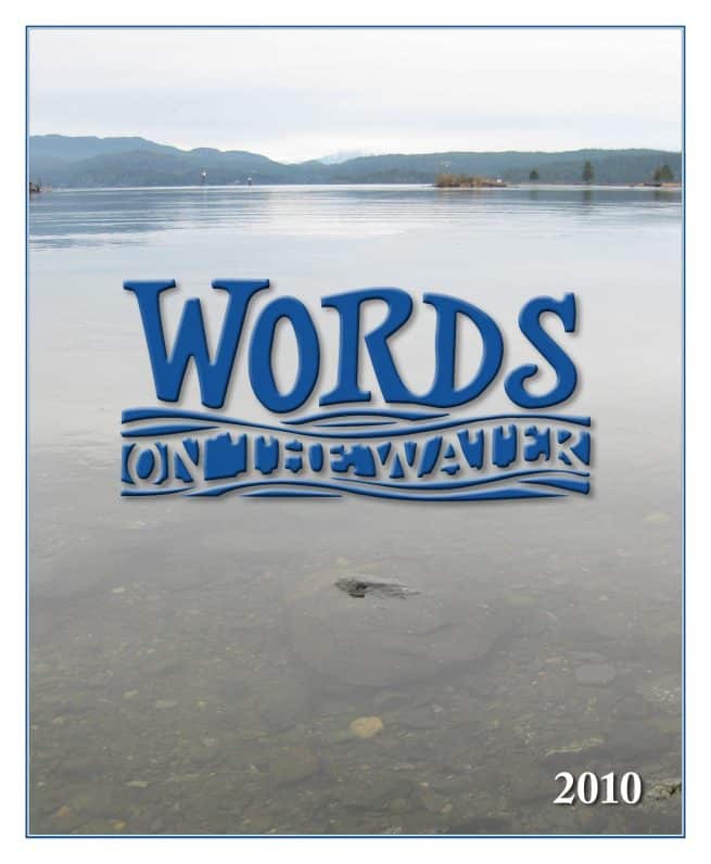 A calm lake with mountains in the distance. Over the water, "Words on the Water" is written in blue, wavy text. The year "2010" is in the lower right corner.